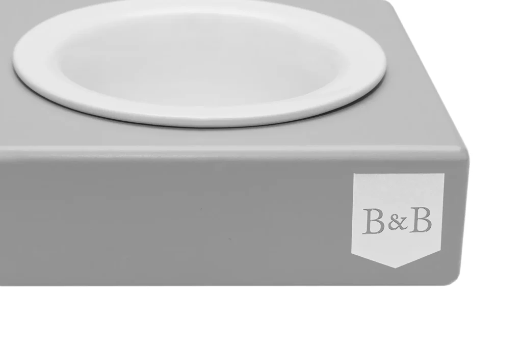 dog bowl ceramic grey with wooden frame close-up