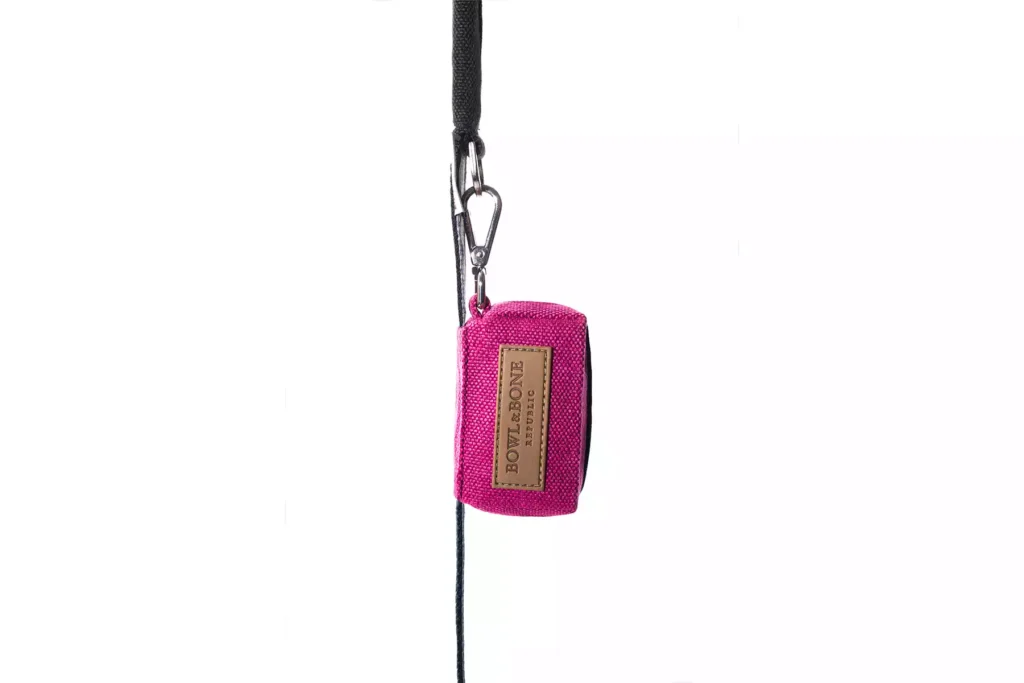 dog waste bag pink on the lead